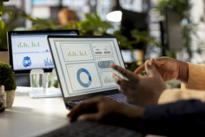 Business analyst meeting with a coworker to review financial report